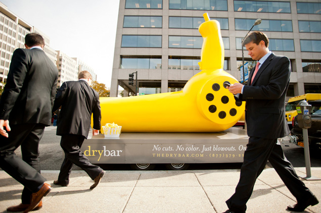 Get a Free Blowout at Drybar by Tweeting a Pic of “Buttercup,” a 13-Foot Yellow Hair Dryer Mascot