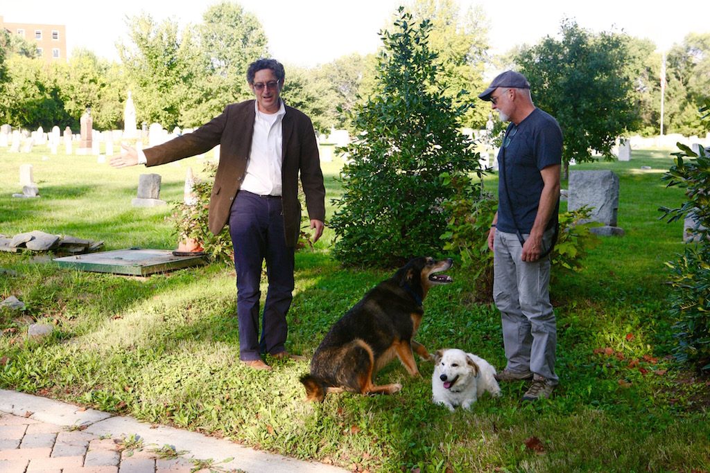 img_8109 - Washingtonian Guy Palace (left) with a Congressional Cemetery dog walker at the site of Charles Siegert's grave. Photo by Evy Mages.