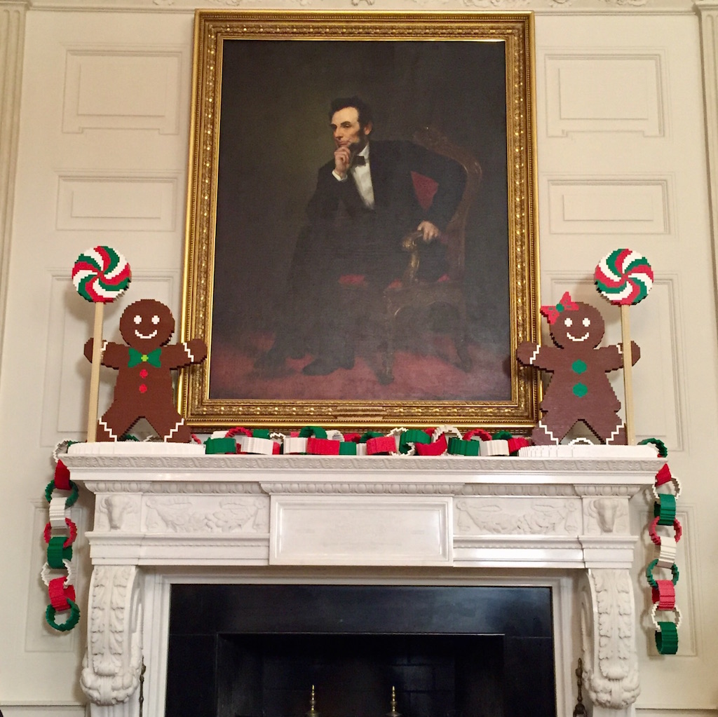 Painting of Abraham Lincoln framed by lego gingerbread men. Photo by Andrea Marks.