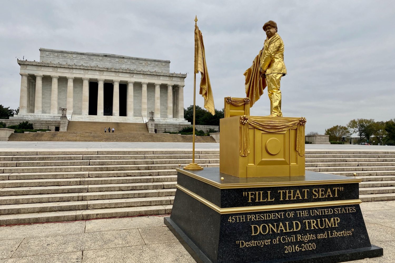 There’s a Living Statue of Trump Peeing on RBG’s Court Seat in Front of the Lincoln Memorial