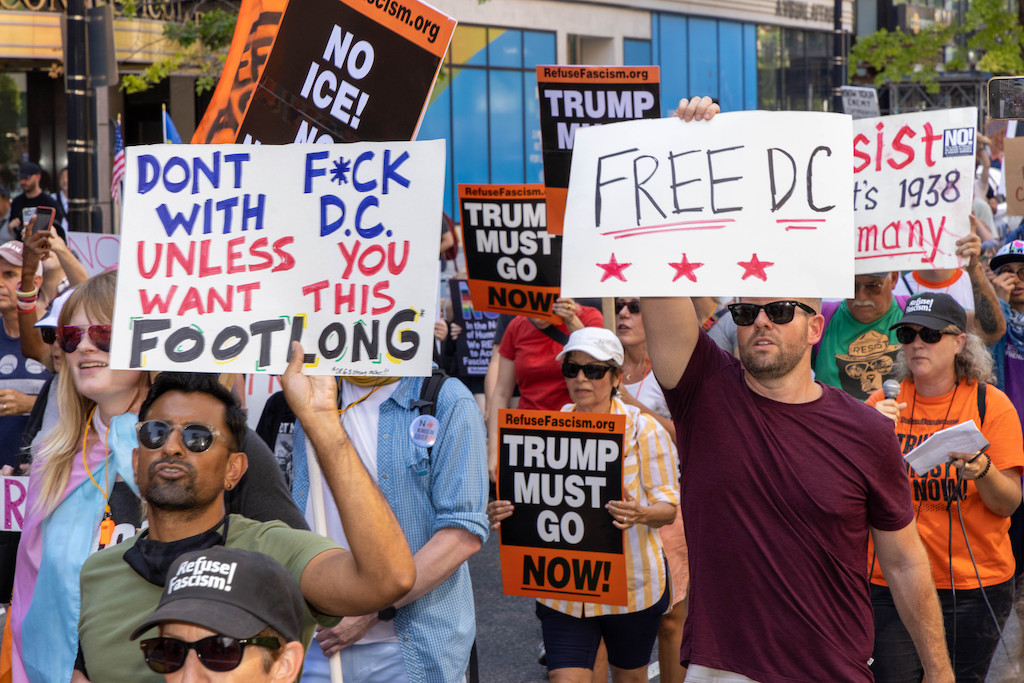 sandwich guy protest signs 2 - Washingtonian