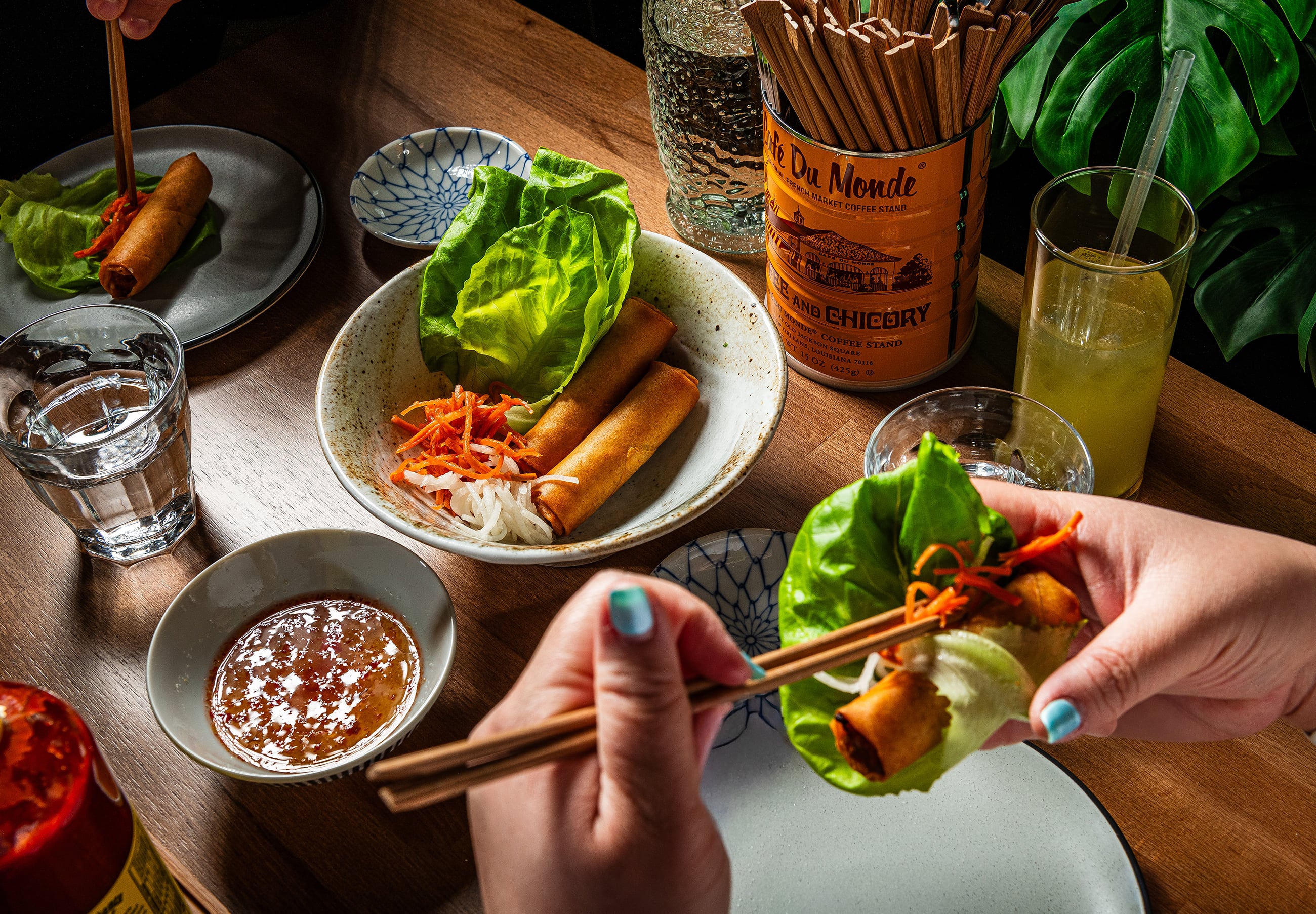 Table-Action-Shot--Spring-rolls_drinks-scaled-down - Washingtonian