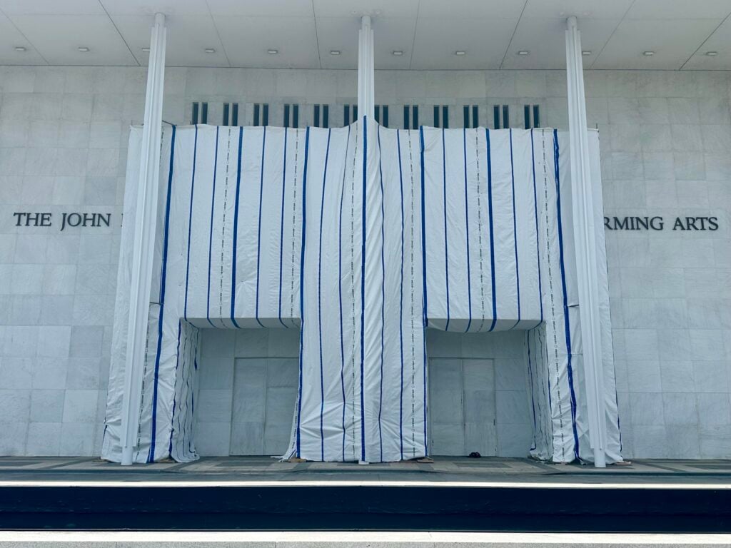 The tarp covering the sign on the front of the Kennedy Center, where Donald Trump's name was recently removed.