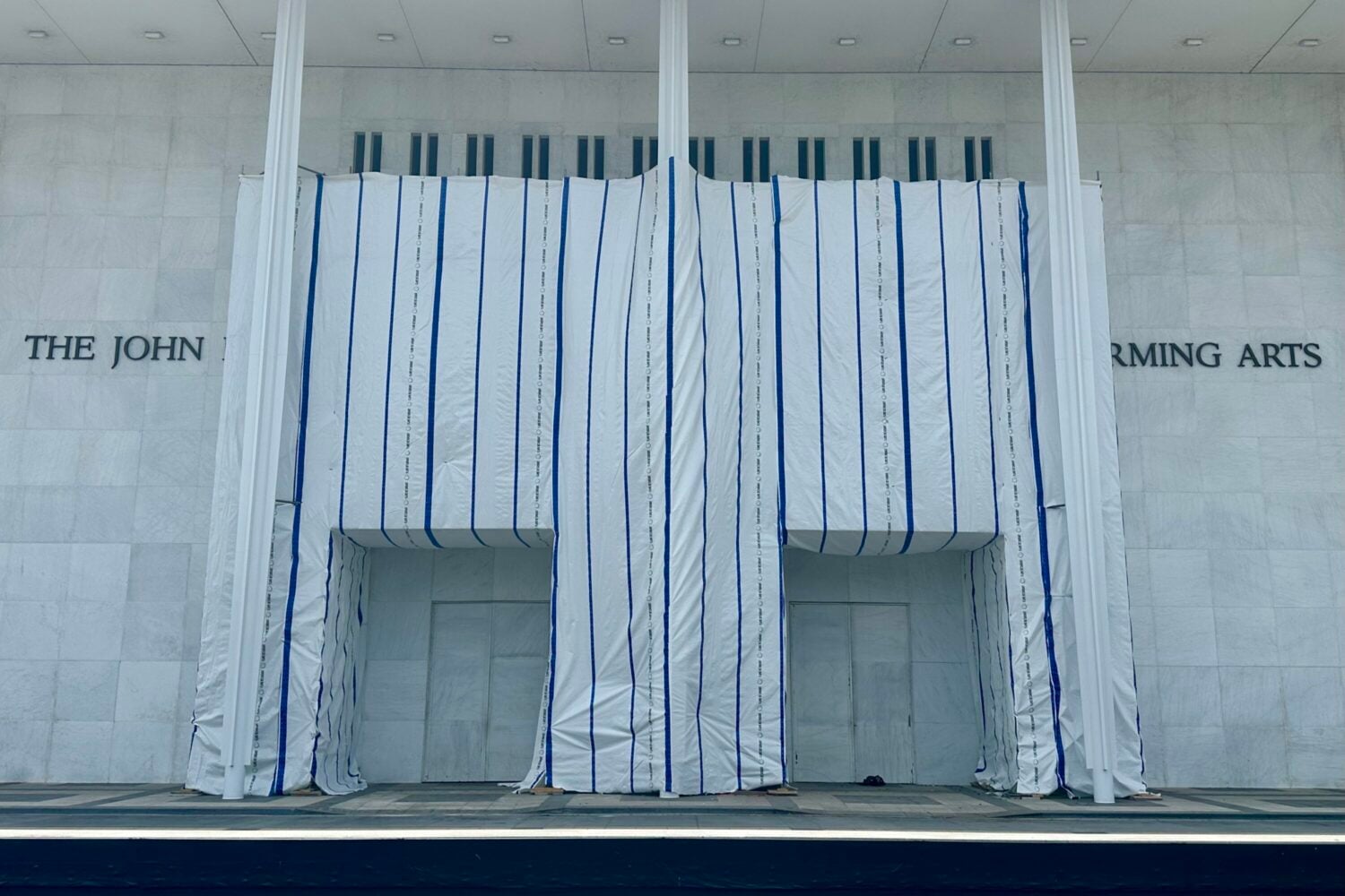 The tarp covering the sign on the front of the Kennedy Center, where Donald Trump's name was recently removed.